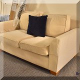 F58. Upholstered love seat. 31”h x 63”w x 36”d 